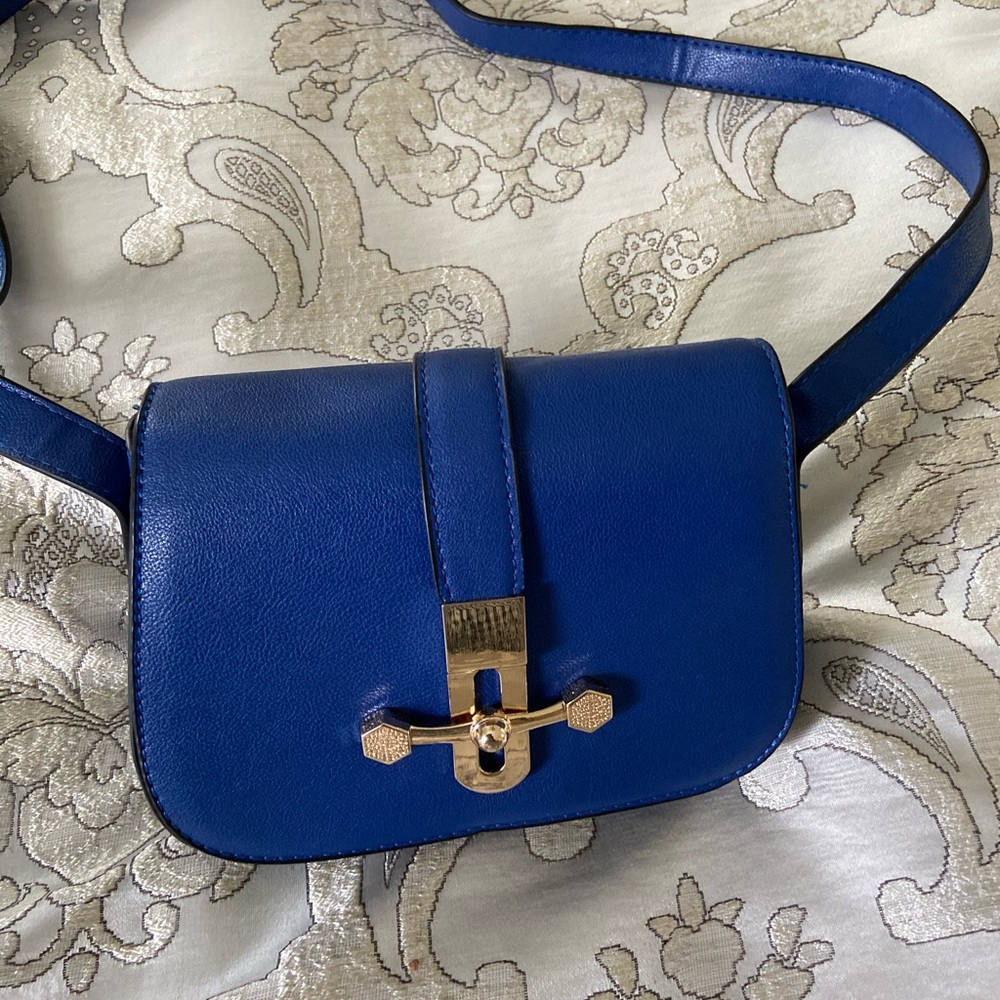 Striking blue cross body bag with gold trim